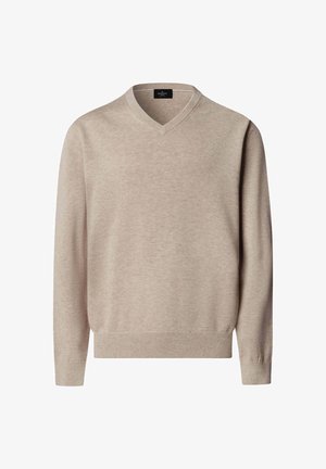 Beige lange mouw V-hals trui met geribbelde manchetten en zoom, gemaakt van zacht gebreide stof, weergegeven tegen een effen witte achtergrond.