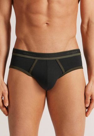 Schwarze Herrenunterhosen mit olivgrünen Akzenten, im körpernahen Design und aus weichem Stoff. Der Bund ist mit "intimissimi"-Markenschriftzug in passenden Farben versehen.