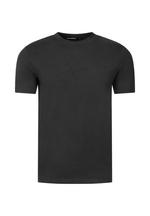T-shirt nera a maniche corte con collo rotondo e logo in rilievo discreto al centro del petto.