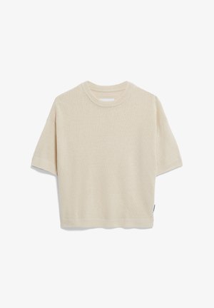 Top crème à manches courtes en côtes avec un col rond et une coupe décontractée. Texture douce avec des motifs en côtes horizontales. Étiquette sur la couture latérale.