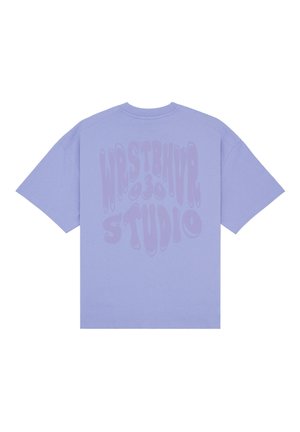 Lavender short-sleeve t-shirt with large distorted text "WRSTBHVR 030 STUDIO" printed on the back in a slightly darker shade.