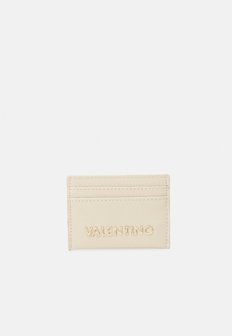 Valentino cardholder in beige textured leather with four card slots and embossed logo on front. Smooth, minimalist design.