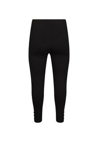 Mustad retuusid, mis on valmistatud venivast kangast, omavad sujuvat tekstuuri ja keskmise kõrgusega vööd, millel on dekoratiivsed nööpkaunistused pahkluude juures.