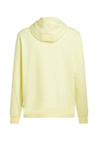 Sweat à capuche jaune avec une texture douce, doté d'une poche kangourou, de poignets côtelés et d'une coupe décontractée. Vue arrière montrant le détail de la capuche.