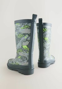 Gray waterproof boots with a green and black abstract pattern, a rounded toe, sturdy treaded sole, and pull tabs on the sides.