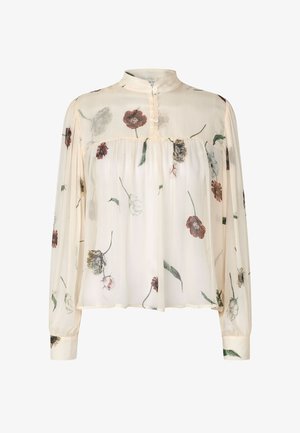Camicia floreale con maniche lunghe, realizzata in leggero tessuto color crema. Presenta un collo alto, una patta con bottoni e vari motivi floreali in rilievo.