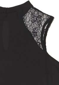 Black top featuring a high neckline, lace accents at the shoulders, soft fabric, and a smooth texture with a concealed zipper.