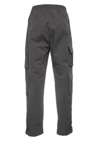 Gray cargo pants feature a relaxed fit, elastic waistband, multiple side pockets, and cuffs. Material appears lightweight with a smooth texture.