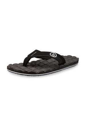 Black flip-flop with textured, cushioned sole, featuring black straps and a white accent line along the sole edge. Logo detail present.