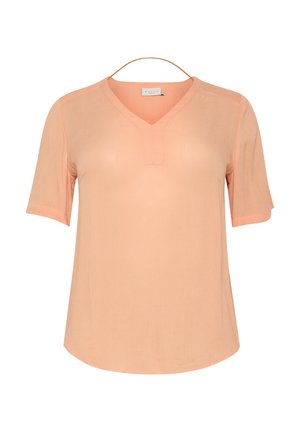 Blouse V à col en pêche clair avec des manches courtes, fabriquée en tissu doux et texturé. Présente un détail de panneau discret le long de l'encolure.