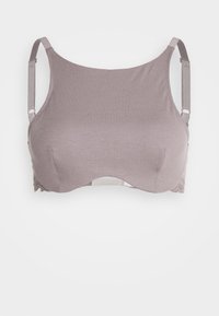 Mauve rebrast ribi brezžični modrček z gladko teksturo, širokimi naramnicami in čipkastim detajlom na dnu. Preprost dizajn, brez žice.