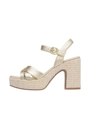 Gouden metallic sandaal met bandjes, een gevlochten jute plateau, blokhak en verstelbare enkelriem; gladde textuur met een geweven zool.