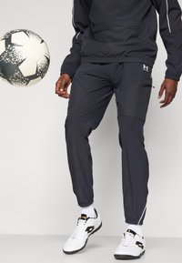 Under Armour CHALLENGER WARM UP  - Tracksuit bottoms - black/white