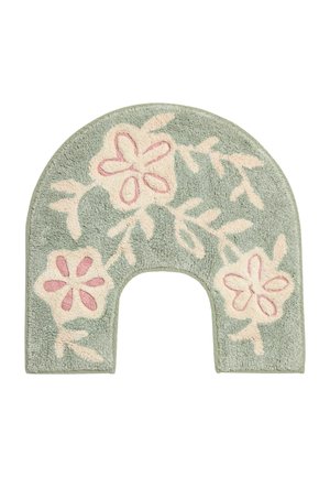 Green U-shaped bathroom rug with pink and cream floral and leaf patterns and soft textured fabric.