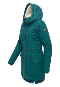 Teal winter parka with a textured, fur-lined hood, front pockets, and snap buttons, featuring a subtle logo patch on the sleeve.