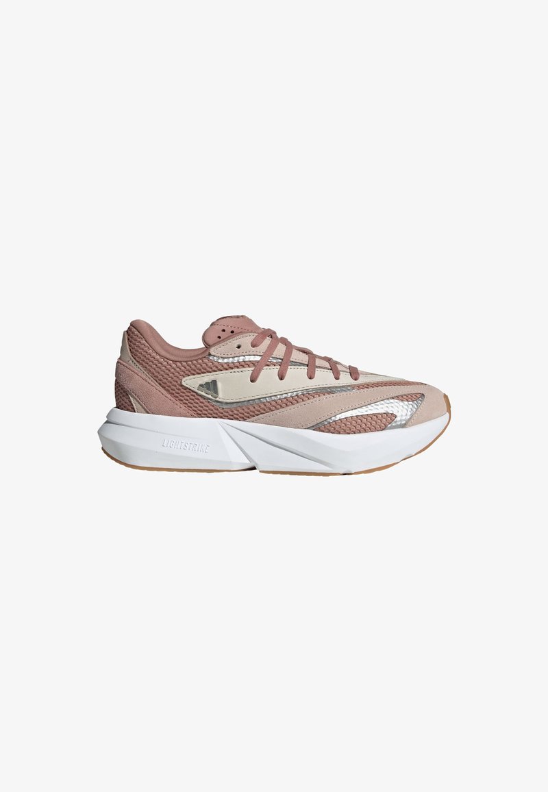 Athletic shoe featuring a light pink mesh upper, beige accents, reflective details, and a thick white sole with a textured gum rubber outsole.