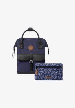 Navy backpack with a textured black flap, adjustable handles, and a smaller paisley-patterned pouch. Features zipper closures and leather accents.