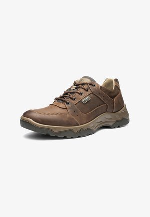 Brown leather shoe with gray accents, textured upper, and padded collar. Features lace-up design and rugged, patterned outsole for traction.