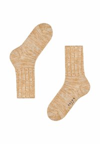 Żółto-białe skarpetki w wzory, wykonane z teksturowanego materiału dzianinowego. Posiadają prążkowane mankiety oraz wygodny kształt dopasowany do stóp.