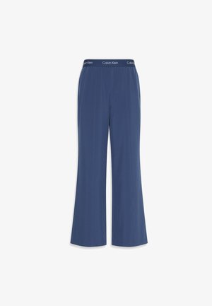 Navy wide-leg pants made of soft fabric with a smooth texture. Features an elastic waistband with "Calvin Klein" logo along the top.