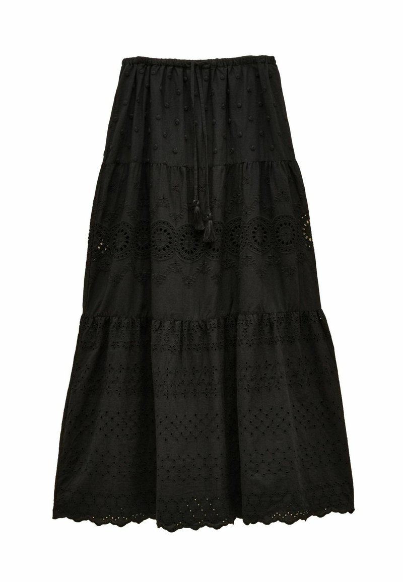 Čierna vrstvená sukňa s vyšívanými vzormi a otvormi. Má šnúrkový pás a textúrovanú, ľahkú látku.