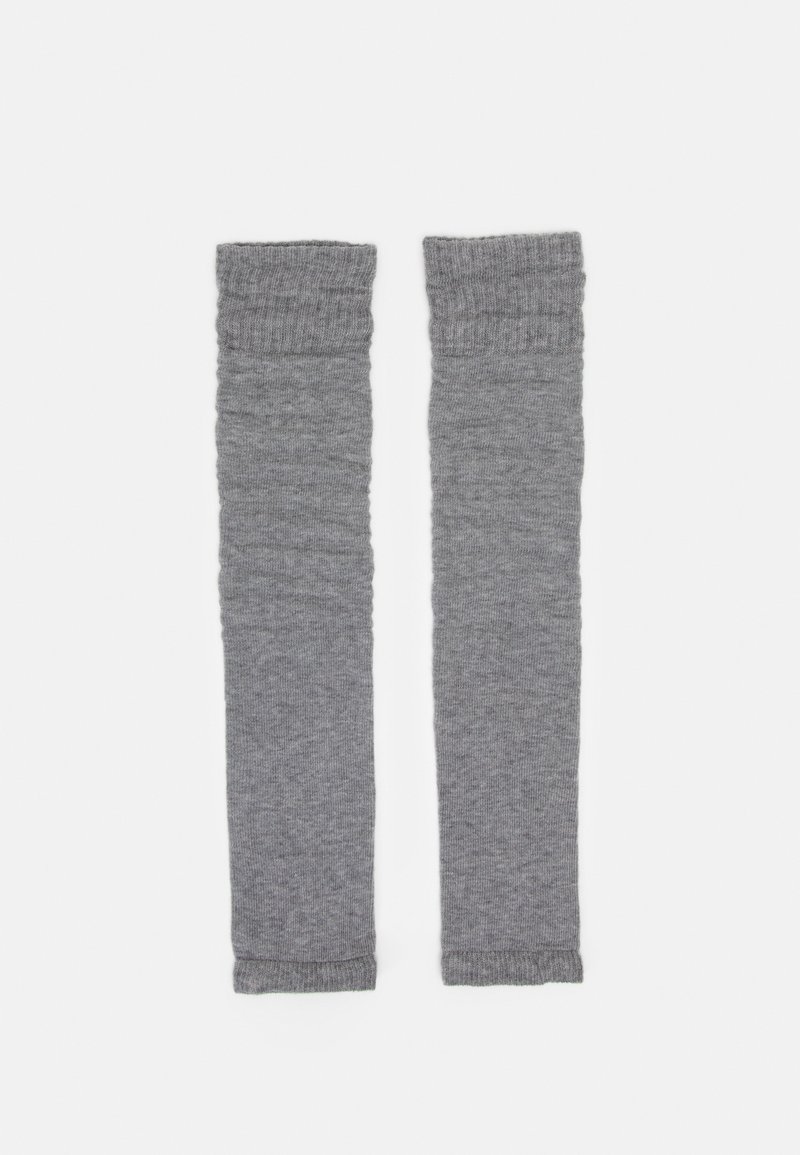 Graue Beinstulpen aus weichem Strickstoff. Gerippte Textur oben und unten mit geradem Design. Eignet sich gut zum Layering.
