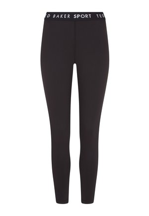 Schwarze Stretchleggings mit hohem Bund und weißem Branding, entworfen für Komfort und Sportbekleidung, mit einer glatten Textur.