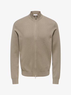 Beige zip-up sweater with a high collar, made of textured fabric. Features long sleeves and a fitted hem with a silver zipper.
