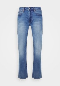 Jean denim bleu à coupe droite avec légère décoloration sur les cuisses, poches avant, passants de ceinture et fermeture par bouton à la taille.
