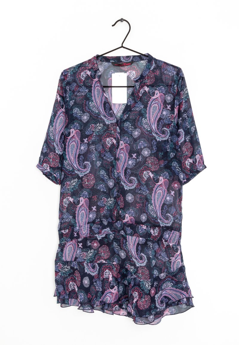 Dark floral blouse with paisley pattern in pink and teal, featuring a button-up design and short sleeves, hung on a black hanger.