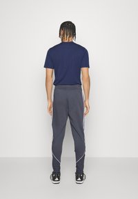 adidas Performance TIRO 23 LEAGUE - Jogginghose - team onix