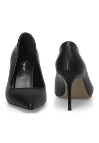 Black leather high heels with a pointed toe and stiletto heel. Smooth texture and simple design, featuring a branded insole.