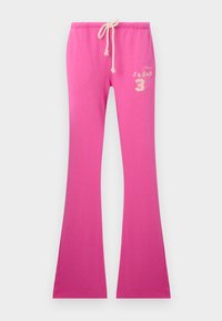 Pink flared sweatpants with a drawstring waist, featuring a soft texture and embroidered design on the left side.