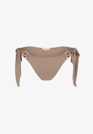 Tan bikini bottom with tie sides and decorative gold-tone hardware featuring a central gem accent. Smooth fabric with a subtle sheen.