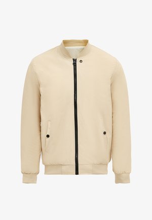 Beżowa kurtka bomberka z czarnym zapięciem na suwak, dwoma bocznymi kieszeniami, ściągaczami na rękawach oraz gładkim, lekkim materiałem. Prosty design bez wzorów.