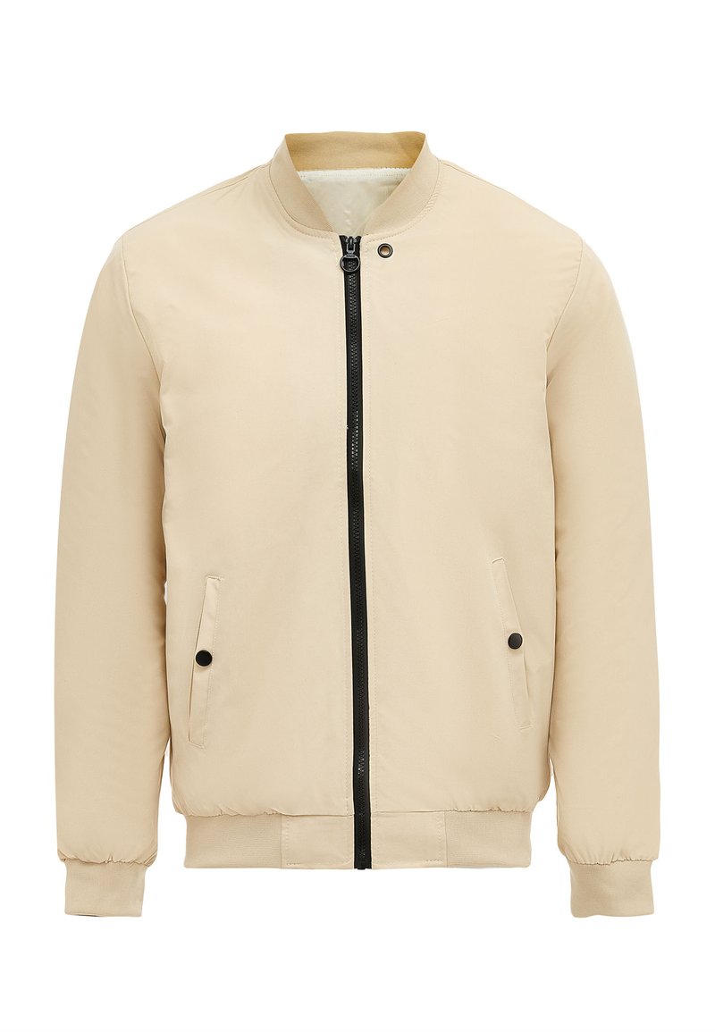 Beige bomberjack met een zwarte ritssluiting, twee zijzakken, geribde manchetten en een soepele, lichte stof. Eenvoudig ontwerp zonder patronen.