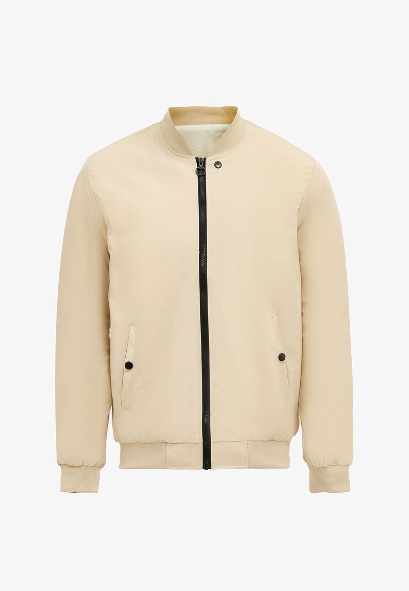 Beige bomberjack met een zwarte ritssluiting, twee zijzakken, geribde manchetten en een soepele, lichte stof. Eenvoudig ontwerp zonder patronen.