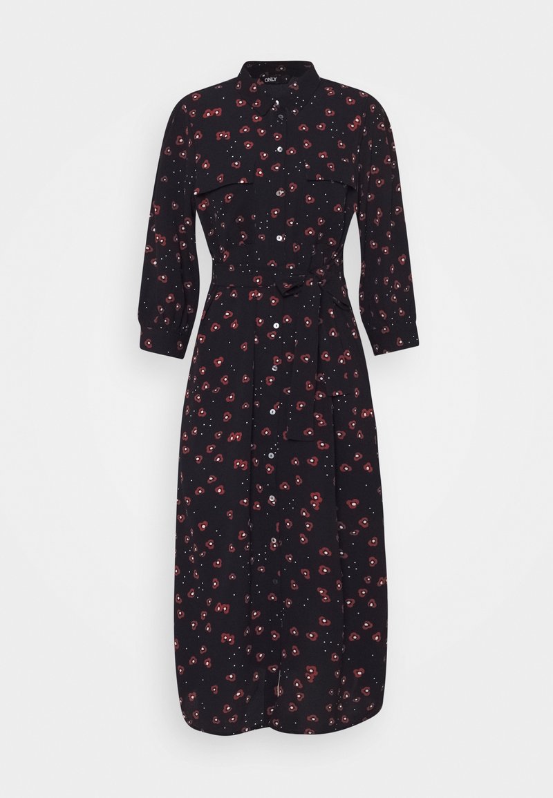Robe noire avec col, manches longues, ceinture nouée à la taille et ourlet à hauteur du genou. Présente un motif floral rouge sur un fond à pois.