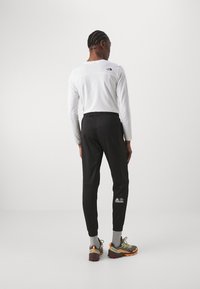 The North Face PANT - Treniņtērpa apakšdaļas - black