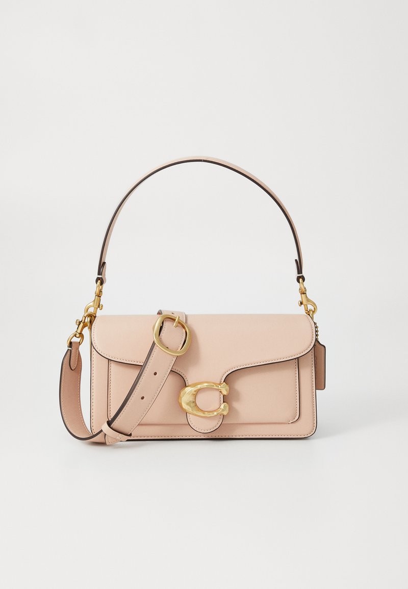 Pink leather handbag with a fold-over flap, gold hardware, and a detachable shoulder strap. Notable C-shaped clasp detail on the front.