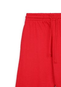 Rote Jogginghosen aus leichtem Baumwollstoff, mit einem elastischen Bund und verstellbaren Kordeln sowie einer lockeren Passform.