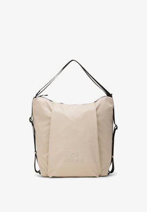 Beige blød stofnet med sorte justerbare skulderstropper og DEHA-logo på frontens midte.