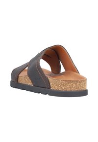 Zwarte leren instapsandaal met kurken zool. Beschikt over een kruislings ontwerp, tan leren binnenzool en een gestructureerde buitenzool voor grip.