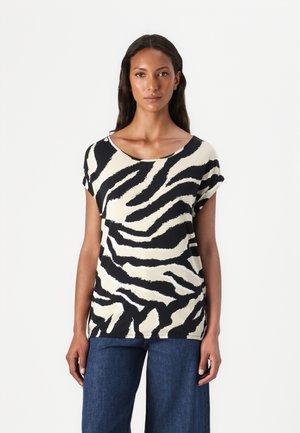Svart og kremfarget skjorte med zebra-striper og korte ermer, bred halsutskjæring og avslappet passform. Stoffet ser mykt ut med en jevn tekstur.
