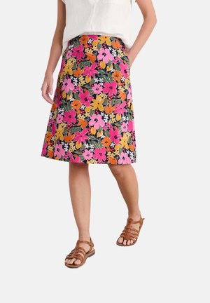 Floral A-line skirt featuring vivid pink, orange, and yellow flowers on a black background. Made of lightweight fabric, knee-length design.