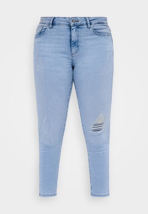 Lichtblauwe skinny jeans met een knoopsluiting en een gescheurd detail aan de rechterdij.