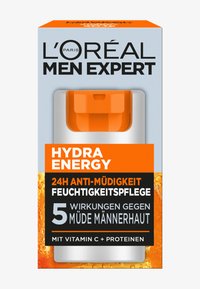 L'Oréal Men Expert Hydra Energy moisturizer has a light blue box with orange accents, featuring bold black text and a practical gray dispenser.