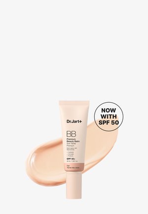 Tube de Dr.Jart+ BB Premium Beauty Balm avec SPF 50+, teinte Fair, présenté sur un fond avec une trace du produit.