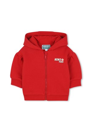 Haut à capuche zippé rouge avec des manches bouffantes, présentant une capuche arrondie et le logo "KENZO PARIS" en blanc sur la poitrine. Matière en coton doux.