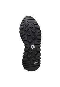 Gummisula i svart, med ett texturerat mönster av stjärnformer och spår för grepp. Märkt med "W6YZ" och "46."